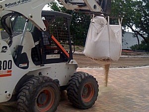 Joint fill placed using all wheel steer bobcat